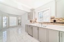 11323 Coventry Boulevard Ne, Calgary, AB  - Indoor Photo Showing Kitchen With Double Sink 