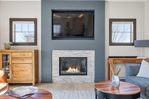 3 Tremblant Point Sw, Calgary, AB - Indoor Photo Showing Living Room With Fireplace