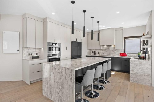 3 Tremblant Point Sw, Calgary, AB - Indoor Photo Showing Kitchen With Upgraded Kitchen