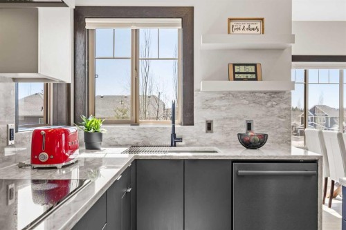 3 Tremblant Point Sw, Calgary, AB - Indoor Photo Showing Kitchen With Upgraded Kitchen
