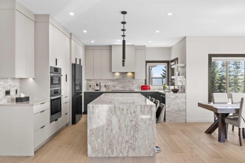 3 Tremblant Point Sw, Calgary, AB - Indoor Photo Showing Kitchen With Upgraded Kitchen