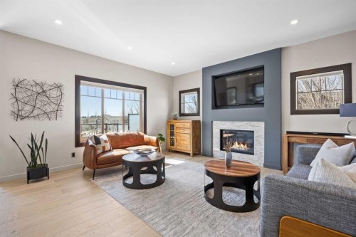 3 Tremblant Point Sw, Calgary, AB - Indoor Photo Showing Living Room With Fireplace