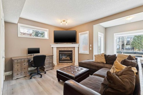 826 Wentworth Place Sw, Calgary, AB - Indoor Photo Showing Living Room With Fireplace