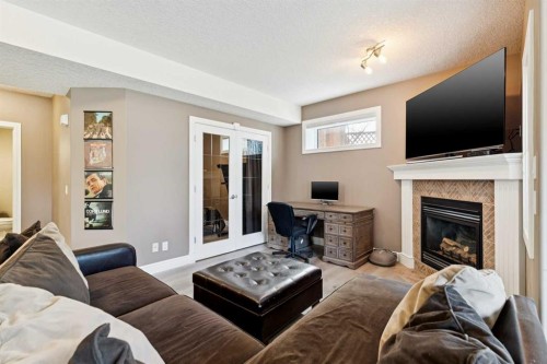 826 Wentworth Place Sw, Calgary, AB - Indoor Photo Showing Living Room With Fireplace