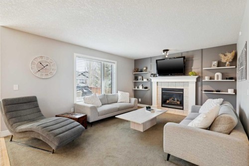 826 Wentworth Place Sw, Calgary, AB - Indoor Photo Showing Living Room With Fireplace