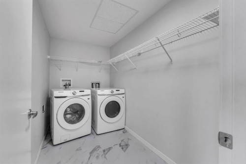 3201-220 Seton Grove Se, Calgary, AB - Indoor Photo Showing Laundry Room