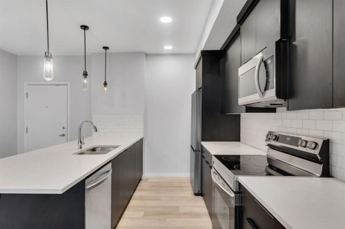 3201-220 Seton Grove Se, Calgary, AB - Indoor Photo Showing Kitchen With Stainless Steel Kitchen With Double Sink With Upgraded Kitchen