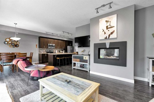 410 Cranford Walk Se, Calgary, AB - Indoor Photo Showing Living Room With Fireplace
