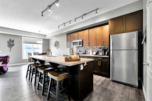 410 Cranford Walk Se, Calgary, AB - Indoor Photo Showing Kitchen With Upgraded Kitchen