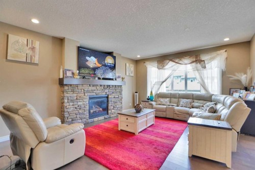 46 Mahogany Passage Se, Calgary, AB - Indoor Photo Showing Living Room With Fireplace