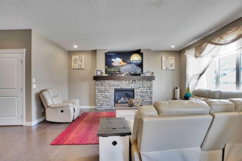 46 Mahogany Passage Se, Calgary, AB - Indoor Photo Showing Living Room With Fireplace