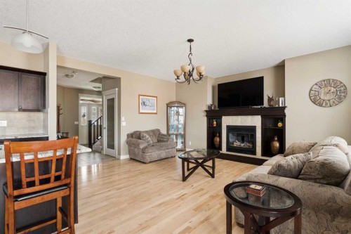 417 Silverado Boulevard Sw, Calgary, AB - Indoor Photo Showing Living Room With Fireplace