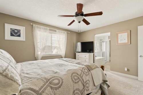 417 Silverado Boulevard Sw, Calgary, AB - Indoor Photo Showing Bedroom