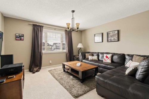 417 Silverado Boulevard Sw, Calgary, AB - Indoor Photo Showing Living Room