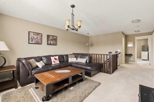 417 Silverado Boulevard Sw, Calgary, AB - Indoor Photo Showing Living Room