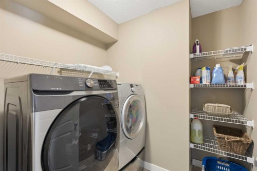 417 Silverado Boulevard Sw, Calgary, AB - Indoor Photo Showing Laundry Room