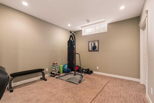 417 Silverado Boulevard Sw, Calgary, AB - Indoor Photo Showing Gym Room