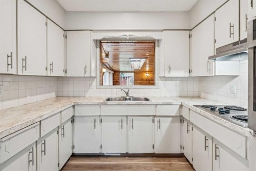 1260 Lake Sylvan Drive Se, Calgary, AB - Indoor Photo Showing Kitchen With Double Sink