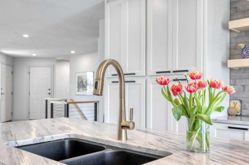 79 Riverview Circle, Cochrane, AB - Indoor Photo Showing Kitchen With Double Sink