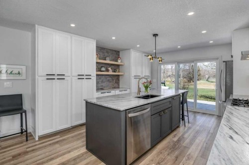 79 Riverview Circle, Cochrane, AB - Indoor Photo Showing Kitchen With Double Sink