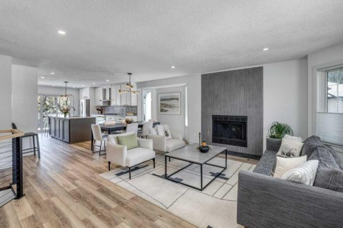 79 Riverview Circle, Cochrane, AB - Indoor Photo Showing Living Room With Fireplace