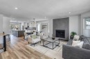 79 Riverview Circle, Cochrane, AB  - Indoor Photo Showing Living Room With Fireplace 