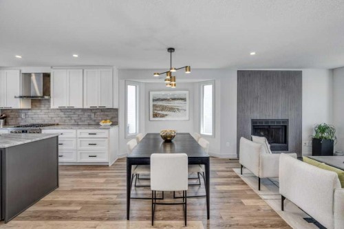79 Riverview Circle, Cochrane, AB - Indoor Photo Showing Kitchen With Upgraded Kitchen