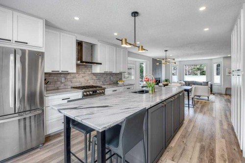79 Riverview Circle, Cochrane, AB - Indoor Photo Showing Kitchen With Upgraded Kitchen