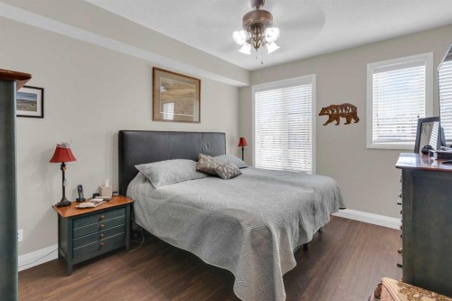 2101-15 Sunset Square, Cochrane, AB - Indoor Photo Showing Bedroom