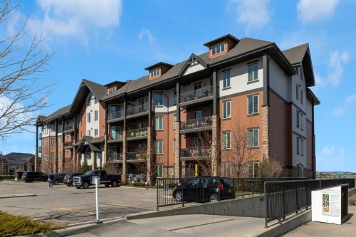 2101-15 Sunset Square, Cochrane, AB - Outdoor With Balcony With Facade
