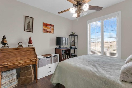 2101-15 Sunset Square, Cochrane, AB - Indoor Photo Showing Bedroom
