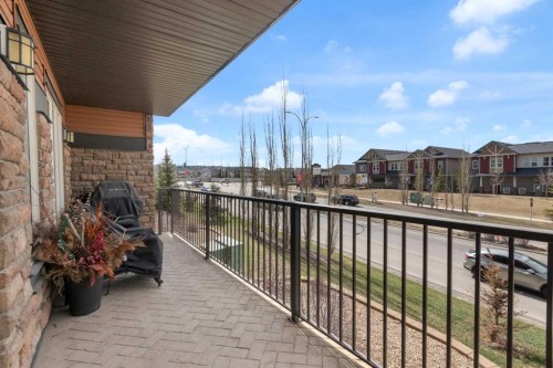 2101-15 Sunset Square, Cochrane, AB - Outdoor With Balcony With Exterior