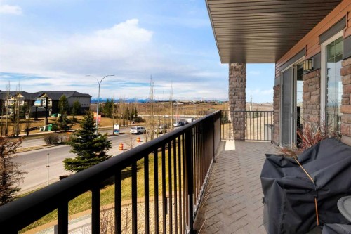 2101-15 Sunset Square, Cochrane, AB - Outdoor With Balcony With Exterior