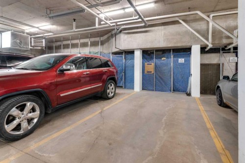 2101-15 Sunset Square, Cochrane, AB - Indoor Photo Showing Garage