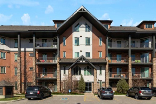 2101-15 Sunset Square, Cochrane, AB - Outdoor With Balcony With Facade