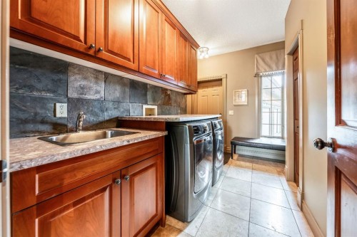 212 Aspen Meadows Place Sw, Calgary, AB - Indoor Photo Showing Laundry Room