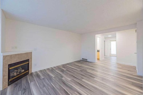 36-111 Tarawood Lane Ne, Calgary, AB - Indoor Photo Showing Other Room With Fireplace