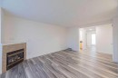 36-111 Tarawood Lane Ne, Calgary, AB  - Indoor Photo Showing Other Room With Fireplace 