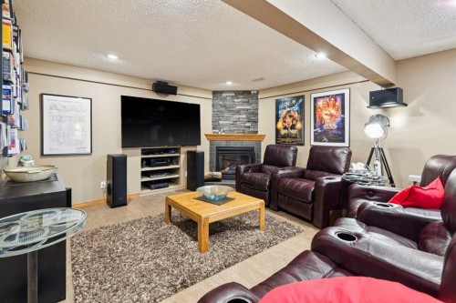 128 Tuscany Vista Crescent Nw, Calgary, AB - Indoor Photo Showing Living Room With Fireplace