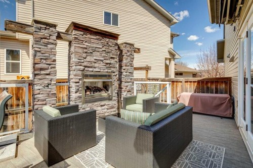 128 Tuscany Vista Crescent Nw, Calgary, AB - Outdoor With Fireplace With Deck Patio Veranda With Exterior
