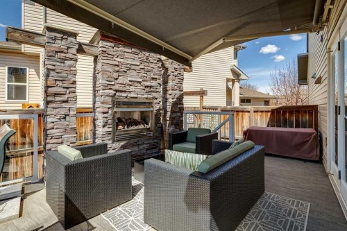 128 Tuscany Vista Crescent Nw, Calgary, AB - Outdoor With Fireplace With Deck Patio Veranda With Exterior