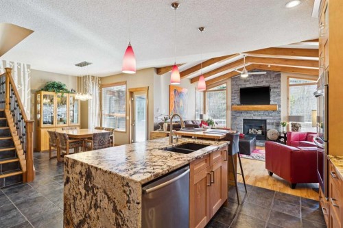 128 Tuscany Vista Crescent Nw, Calgary, AB - Indoor Photo Showing Kitchen With Fireplace With Double Sink