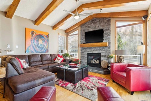 128 Tuscany Vista Crescent Nw, Calgary, AB - Indoor Photo Showing Living Room With Fireplace