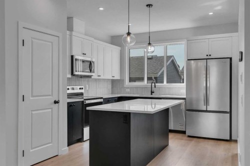 237 Heirloom Way Se, Calgary, AB - Indoor Photo Showing Kitchen With Stainless Steel Kitchen With Upgraded Kitchen