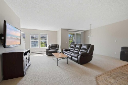18 Auburn Bay Common Se, Calgary, AB - Indoor Photo Showing Living Room