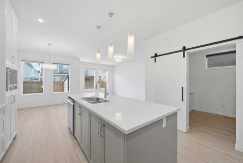 324 Copperhead Way Se, Calgary, AB - Indoor Photo Showing Kitchen With Double Sink