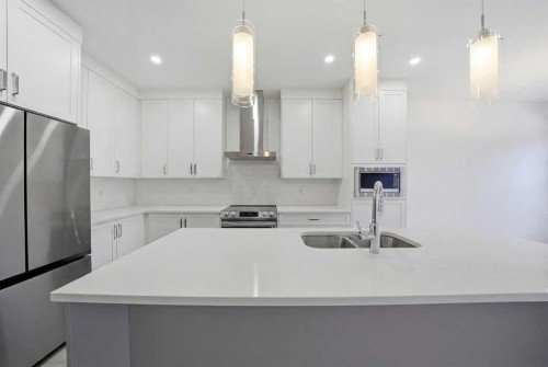 324 Copperhead Way Se, Calgary, AB - Indoor Photo Showing Kitchen With Double Sink With Upgraded Kitchen