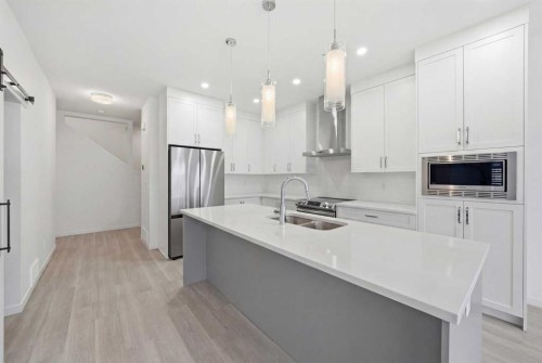 324 Copperhead Way Se, Calgary, AB - Indoor Photo Showing Kitchen With Stainless Steel Kitchen With Double Sink With Upgraded Kitchen