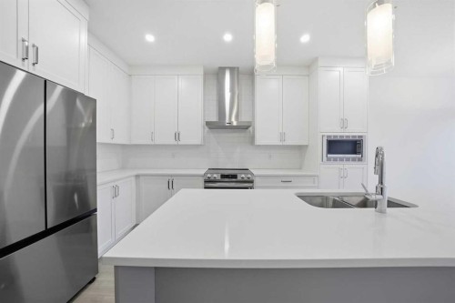 324 Copperhead Way Se, Calgary, AB - Indoor Photo Showing Kitchen With Double Sink With Upgraded Kitchen