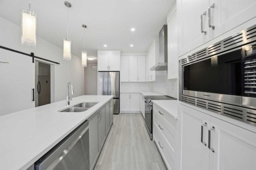 324 Copperhead Way Se, Calgary, AB - Indoor Photo Showing Kitchen With Stainless Steel Kitchen With Double Sink With Upgraded Kitchen